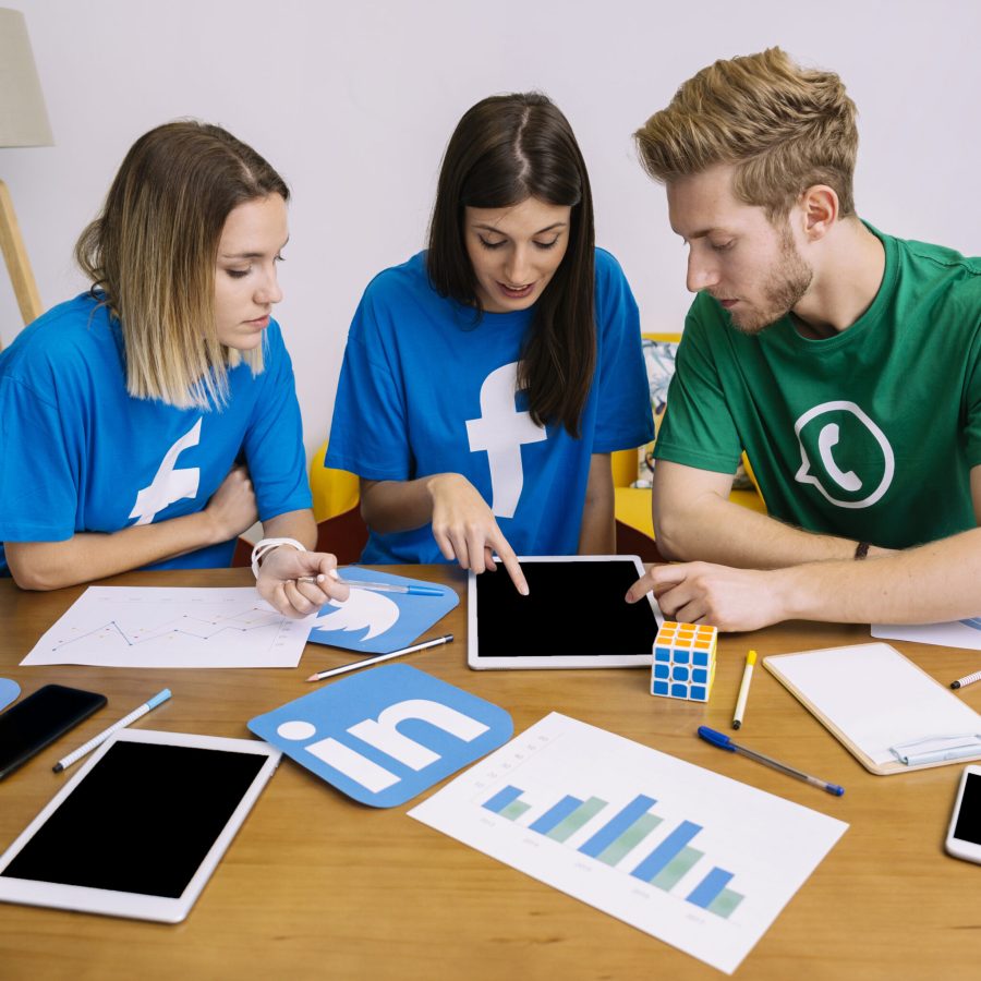 team-social-media-networking-looking-digital-tablet-office